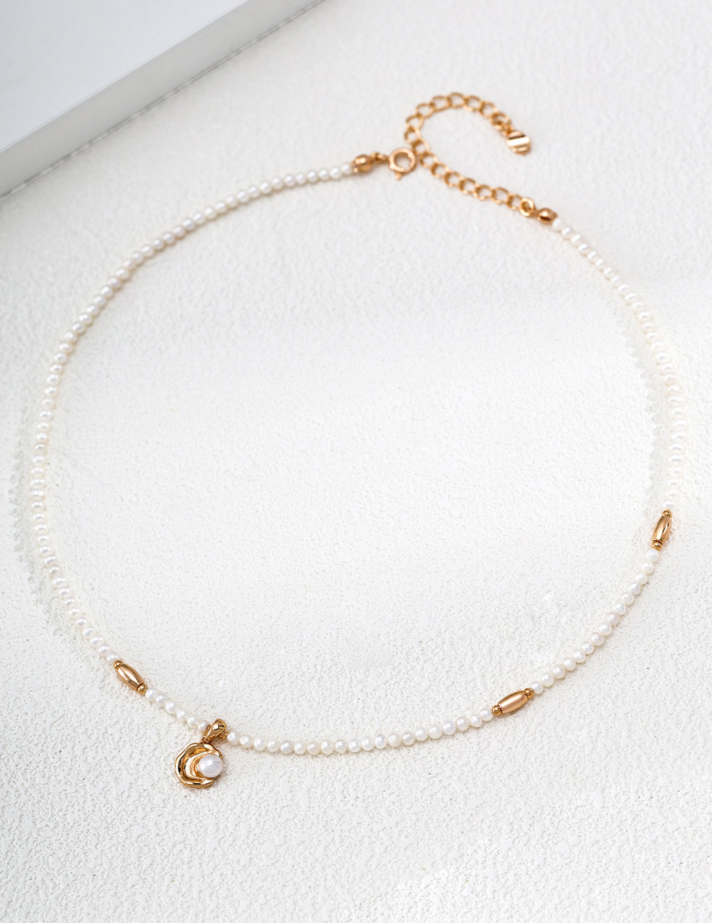 Vintage Pearl necklace arranged in a circle, with small pearls, vintage gold accents and a curved pearl pendant