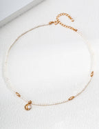 Vintage Pearl necklace arranged in a circle, with small pearls, vintage gold accents and a curved pearl pendant