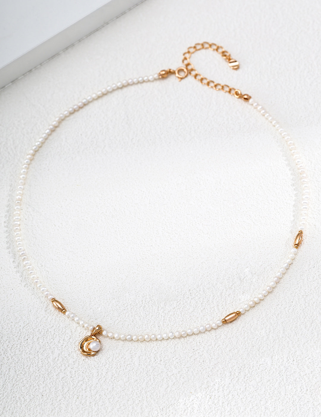 Vintage Pearl necklace arranged in a circle, with small pearls, vintage gold accents and a curved pearl pendant