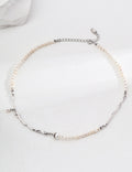 Geometric Baroque pearl necklace in platinum silver arranged in a circle, with irregular metal accents and an extension chain