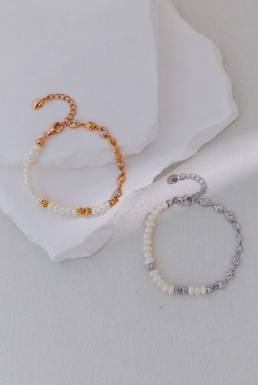 Vintage gold and platinum silver pearl bracelets displayed together, with linked accents and adjustable extension chains